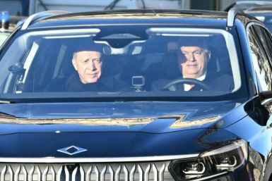 Prime Minister Viktor Orban, right, and President Recep Tayyip Erdogan in a Turkey-made electric car gifted by the Turkish leader