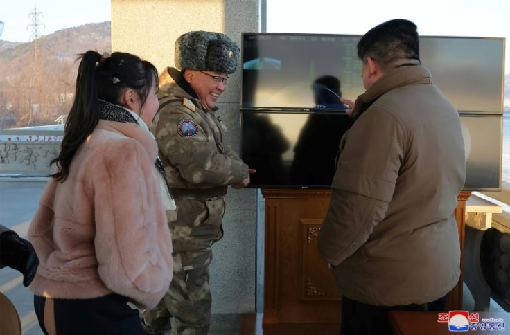 North Korean leader Kim Jong Un (R) was accompanied by his daughter (L) at the latest test launch of the massive ICBM