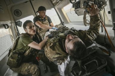 -- AFP PICTURES OF THE YEAR 2023 --Ukrainian military paramedics evacuate a wounded serviceman from the front line near Bakhmut, on March 23, 2023.