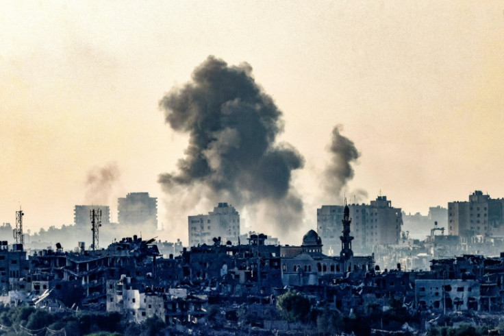 -- AFP PICTURES OF THE YEAR 2023 --A picture taken from the , shows smoke ascending over the northern Gaza Strip following an Israeli strike, amid the ongoing battles between Israel and the Palestinian group Hamas.