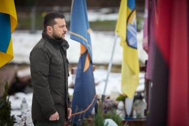 Ukrainian President Volodymyr Zelensky pays his respects at the graves of Ukrainian soldiers in Lviv