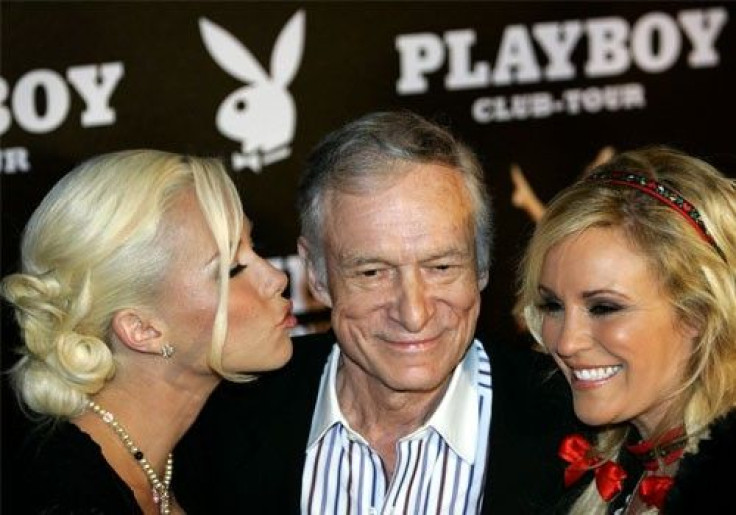 Playboy magazine founder Hugh Hefner (center)