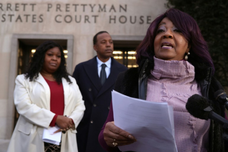 Ruby Freeman (R) speaks to reporters after a jury ordered Rudy Giuliani to pay her and her daughter Wandrea "Shaye" Moss (L) more than $148 million in damages