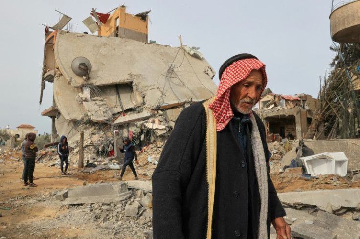 Palestinians check the rubble following Israeli bombardment in Khan Yunis, the southern Gaza Strip