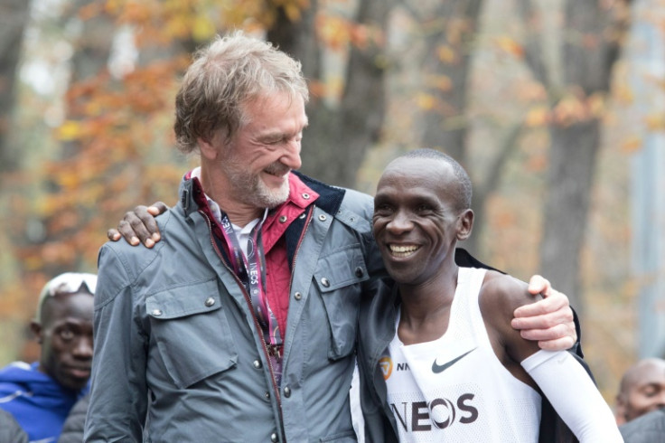 Eliud Kipchoge celebrates with INEOS owner Jim Ratcliffe after the Kenyan broke the two-hour marathon barrier