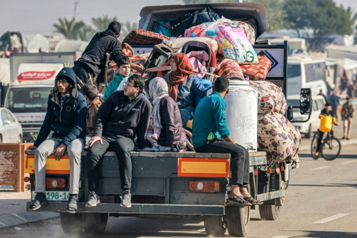 A truck carrying people fleeing the central Gaza Strip arrives in Rafah in the south on Tuesday