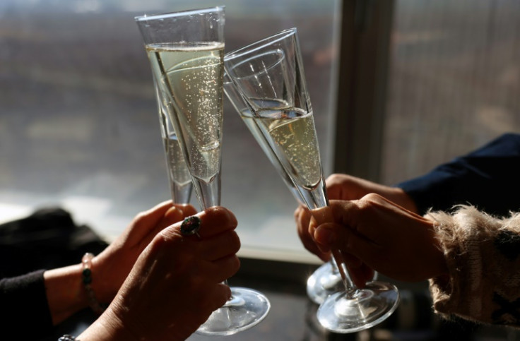 Drinkers toast with a glass of Yasasin sparkling wine, which won a gold medal at the world championships in France in 2020