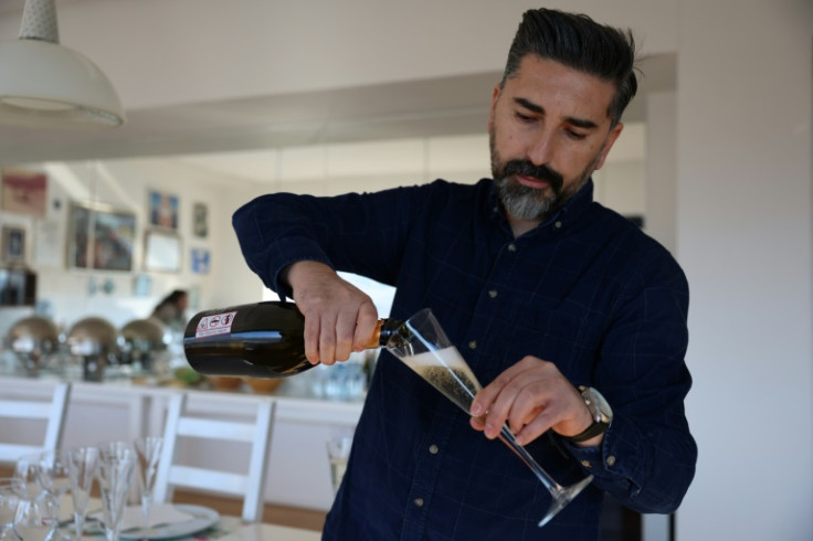 Ahmet Ay, of the Vinkara winery, pours a glass of sparkling wine