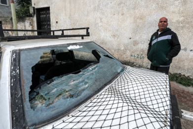 The broken rear windshield of a vehicle at the scene of a deadly Israeli military operation near Qalqilya in the occupied West Bank, on January 2, 2024