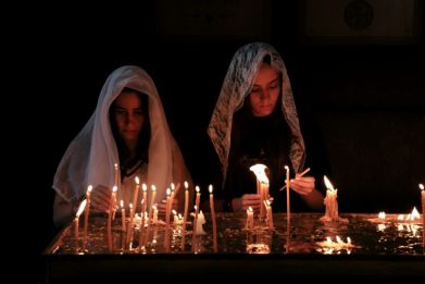 Armenians pray during a service for refugees from Nagorno-Karabakh, seized back from Azerbaijan, at the Saint-Sargis cathedral in Yerevan on October 1, 2023