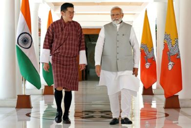 Bhutan's King Jigme Khesar Namgyel Wangchuck (L) walks with India's Prime Minister Narendra Modi during a meeting in New Delhi in 2023