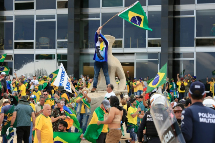 Supporters of Brazilian former President Jair Bolsonaro invade the country's presidential palace in Brasilia on January 8, 2023