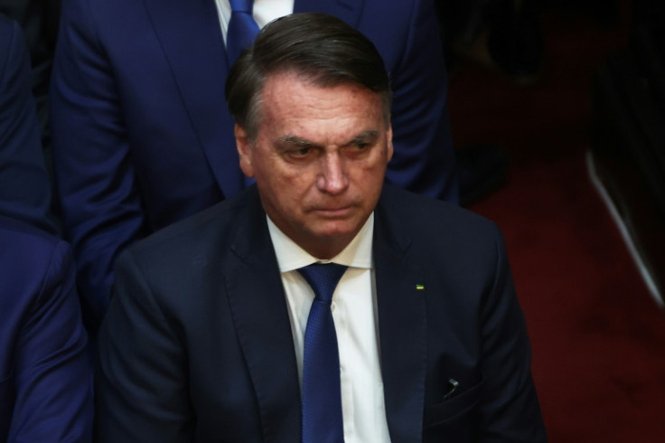 Brazil's former President Jair Bolsonaro, pictured in December 2023, has been barred from running for office for eight years over his attacks on the credibility of the election system