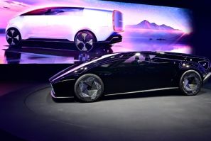 Japanese automaker Honda unveils two new electric vehicle concepts, the Saloon (foreground) and Space-Hub (on screen) during the Consumer Electronics Show (CES) in Las Vegas, Nevada on January 9, 2024