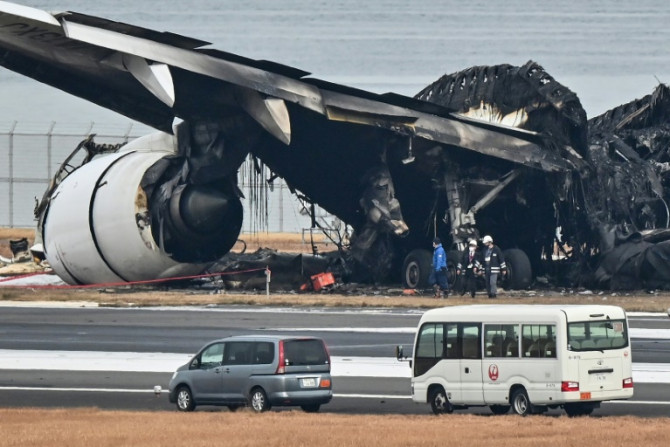 All 379 passengers and crew on the airliner were swiftly evacuated, but five of the six crew died on the smaller plane