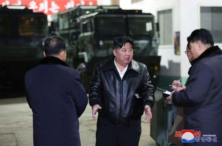 North Korean leader Kim Jong Un (C) labeled South Korea his country's 'principal enemy' while on a tour of a major munitions factory