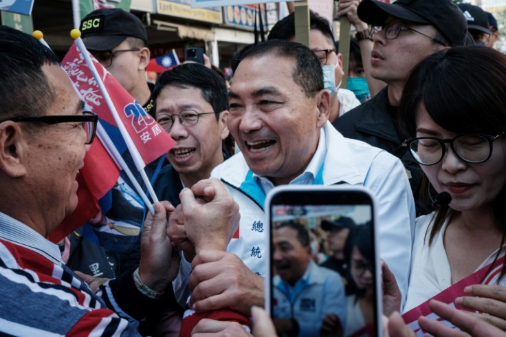 Hou Yu-ih, presidential candidate of the main opposition Kuomintang, visits a market during a campaign rally with legislative candidates in Kaohsiung