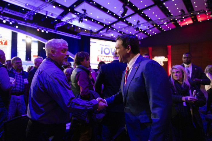 Florida governor and 2024 presidential hopeful Ron DeSantis (R) greets voters at a town hall in Des Moines, Iowa, where he and rival Nikki Haley trail Republican Party nomination frontrunner Donald Trump