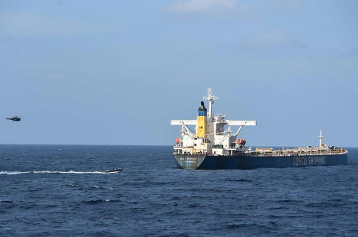 Indian commandos approach the bulk carrier MV Lila Norfolk in the Arabian Sea after an attempted pirate attack, seen in this photo released by the Indian Navy