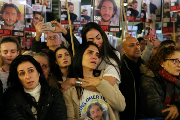 Relatives of Israeli hostages held by Palestinian militants in Gaza join a Tel Aviv rally demanding an end to their ordeal now entering its 100th day