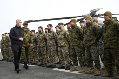 NATO Secretary General Jens Stoltenberg with  British soldiers during a NATO exercise in 2022
