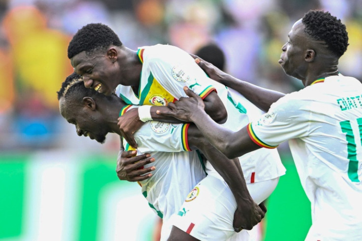 Senegal's Lamine Camara (C) celebrates with teammates after scoring against Gambia at the Africa Cup of Nations on Monday