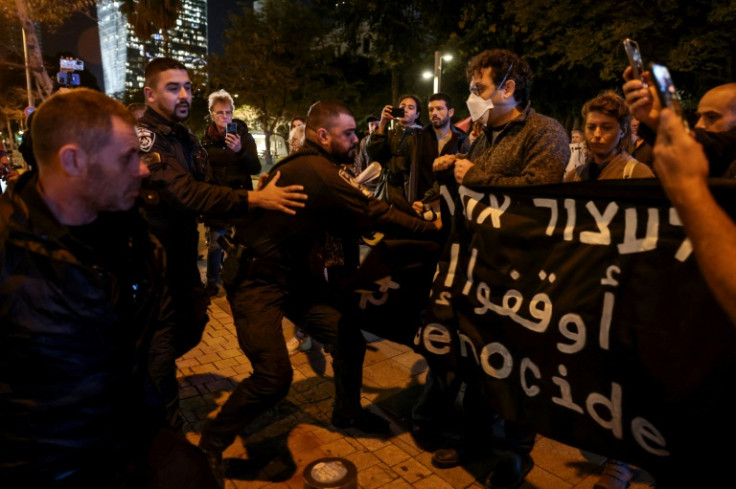 Police disperse a rally by Israeli anti-war demonstrators in Tel Aviv on Tuesday