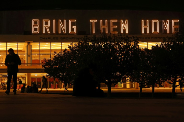 A neon sign reading "Bring them home", referring to the hostages held in Gaza since the October 7 attacks, is displayed in Tel Aviv