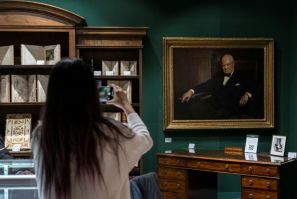 Winston Churchill’s personal desk and a portrait of the late British leader by Arthur Pan, part of the Winston S. Churchill Collection Of Steve Forbes, at the Winter Show in New York City on January 18, 2024