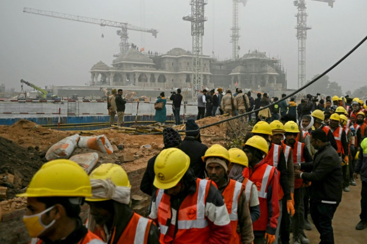 Workers line up at the construction site of the temple to Hindu deity Ram in Ayodhya on December 29