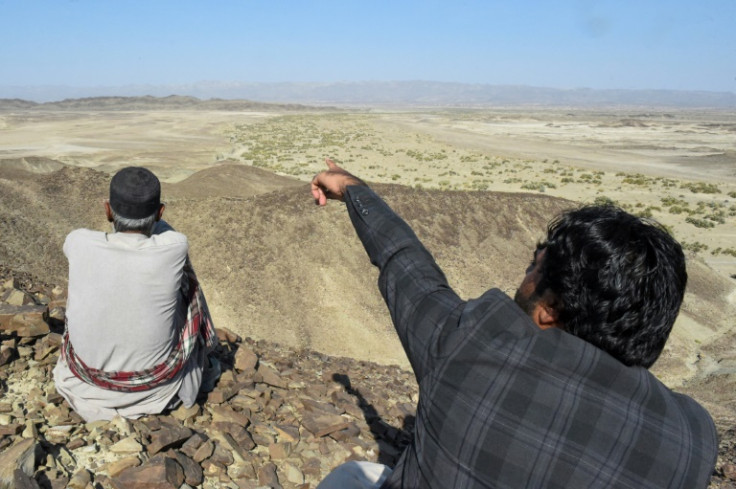 A local resident shows a mountain in the Koh-e-Sabz area of Pakistan's south-west Baluchistan province where Iran launched an airstrike, on January 18, 2024