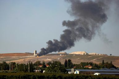 Flames and smoke rise over the Lebanese village of Khiam following Israeli bombardment