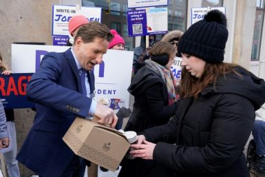 Democratic presidential hopeful Dean Phillips, brings coffee to a Joe Biden Write-In Rally in Manchester, New Hampshire, on January 20, 2024