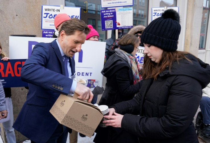 Democratic presidential hopeful Dean Phillips, brings coffee to a Joe Biden Write-In Rally in Manchester, New Hampshire, on January 20, 2024