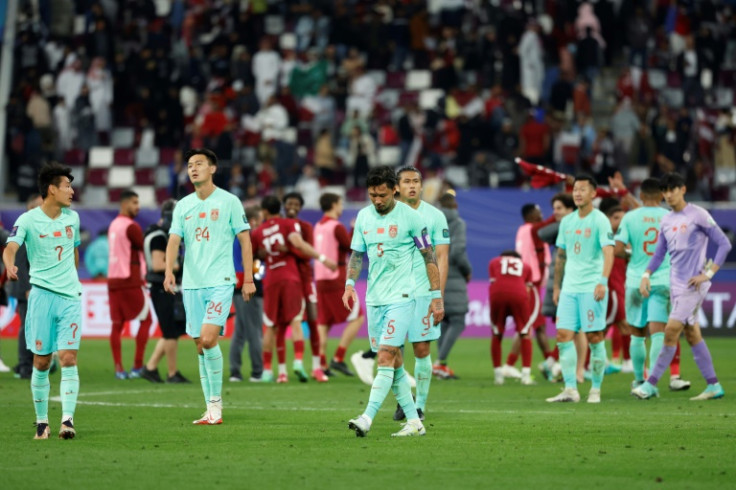 China's players trudge off after defeat