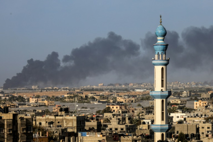 Smoke billows over Khan Yunis in the southern Gaza Strip during Israeli bombardment on January 22, 2024