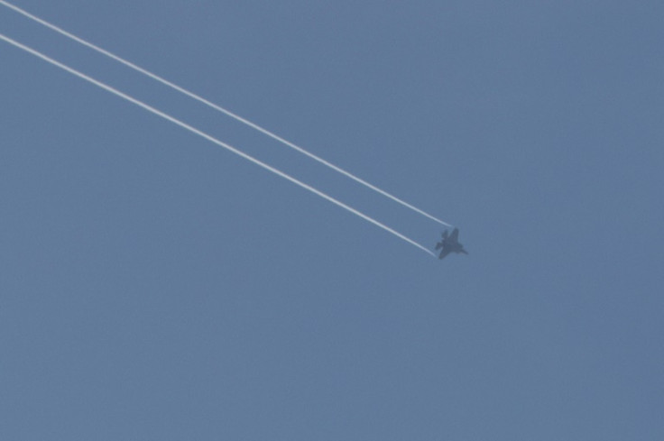 A picture taken from Israel's southern city of Sderot shows a US-made Israeli F-35 jet over the northern Gaza Strip; aid groups have called on countries to stop providing weapons to Israel and Palestinian armed groups
