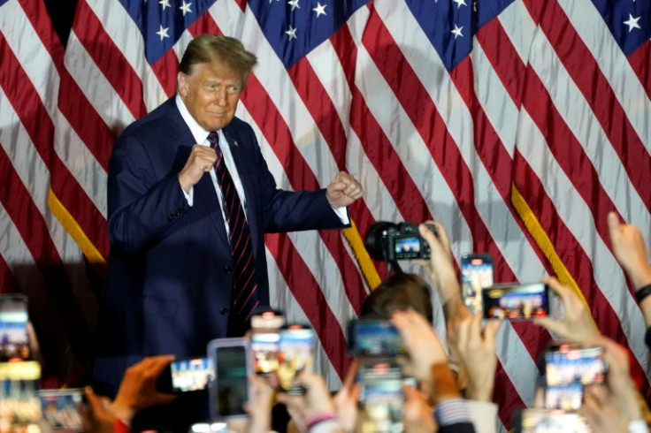 Donald Trump celebrates winning the New Hampshire primary
