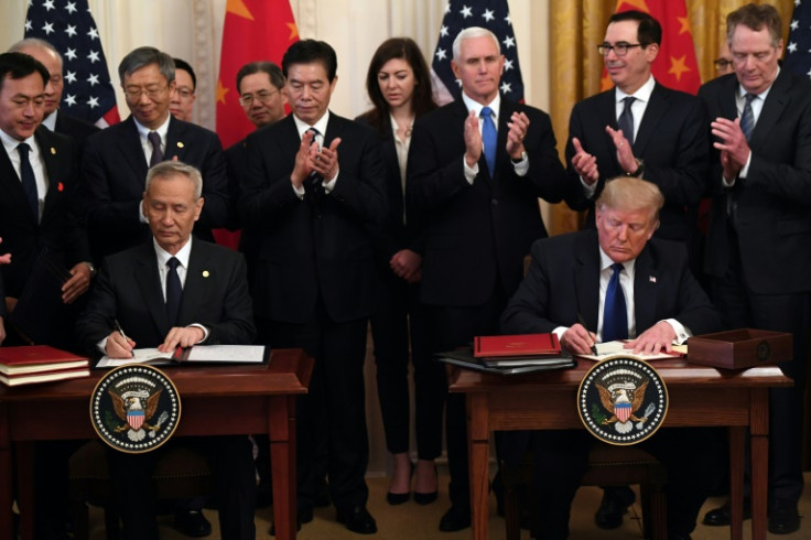 Then US president Donald Trump and China's Vice Premier Liu He sign a trade agreement between the US and China during a ceremony in the White House in January 2020