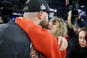 Kansas City tight end Travis Kelce shares a kiss with girlfriend Taylor Swift after the Chiefs booked a return to the Super Bowl with a victory over the Baltimore Ravens