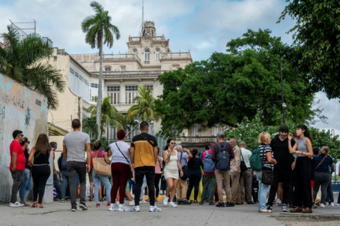 Cubans queue to enter the Spanish embassy in Havana on January 9, 2024