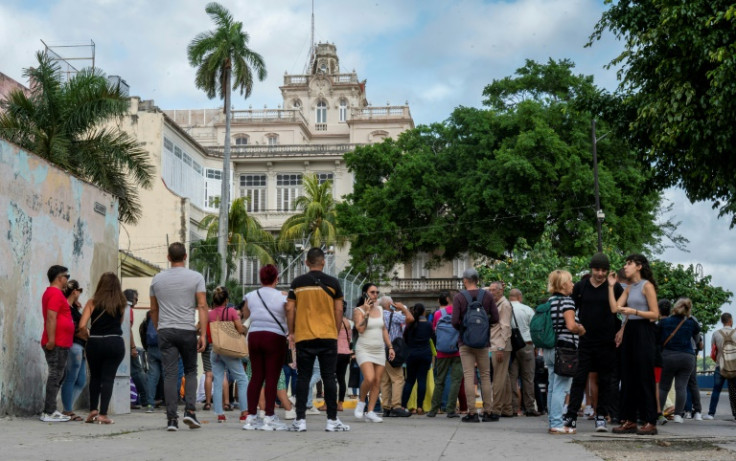Cubans queue to enter the Spanish embassy in Havana on January 9, 2024
