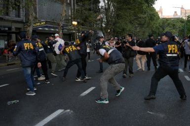 Argentine police clash with protestors outside Congress while lawmakers debate the government's economic reforms in Buenos Aires, February 1, 2024