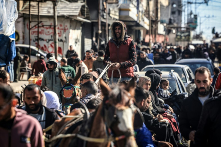 Fleeing civilians clog the streets of the Egyptian border town of Rafah