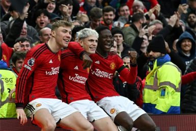 Manchester United's Alejandro Garnacho (C), Rasmus Hojlund (L) and Kobbie Mainoo (R) celebrate a goal against West Ham