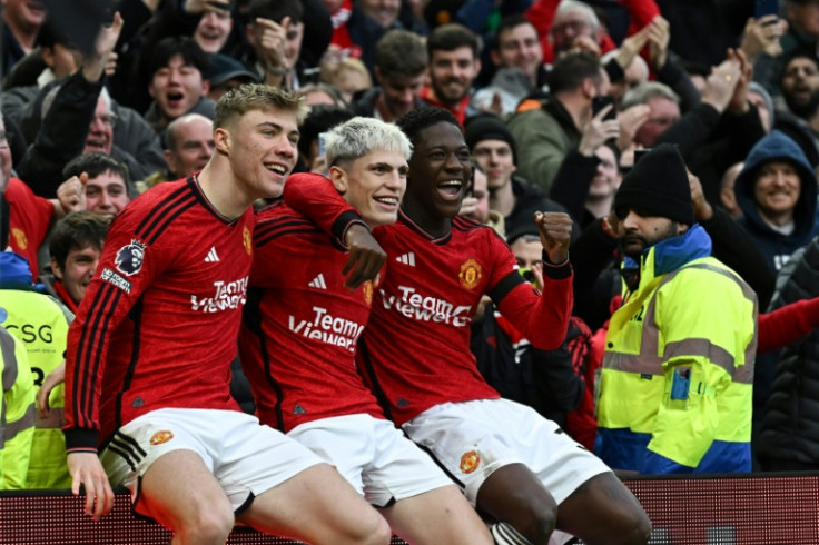 Manchester United's Alejandro Garnacho (C), Rasmus Hojlund (L) and Kobbie Mainoo (R) celebrate a goal against West Ham