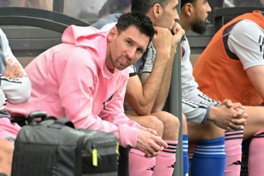 Lionel Messi sits on the bench during the friendly football between a Hong Kong XI and Inter Miami