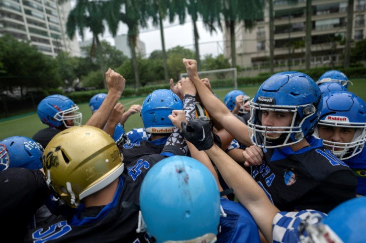 American football players huddle  during a training session of the Rio Football Academy team inside the luxury condominium Peninsula, located at the Barra da Tijuca neighborhood in Rio de Janeiro, Brazil, on January 24, 2024