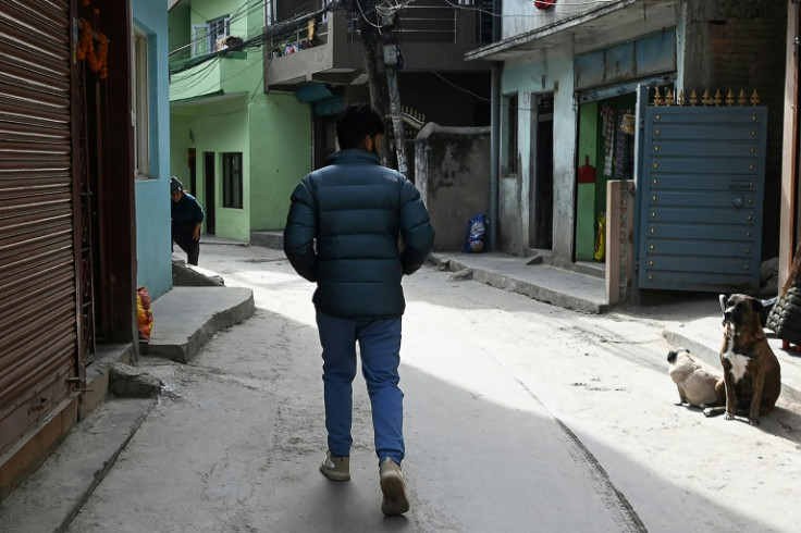 Surya Sharma, who joined the Russian army as a mercenary to fight in the invasion of Ukraine and asked to use a pseudonym for legal reasons, walks along a street in Kathmandu