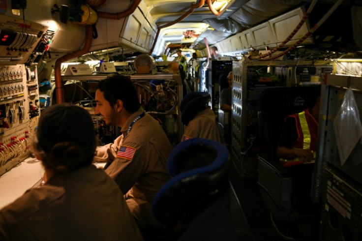 Crew and scientists work aboard NASA's airborne science laboratory, which is expected to visit South Korea, Malaysia and Thailand in coming weeks